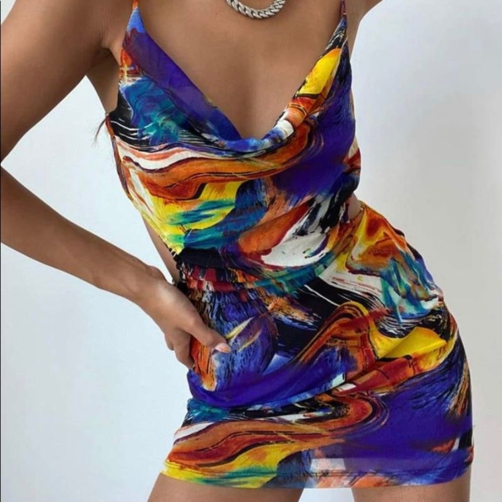 Fun dress with an open back. Never been worn. Size small.